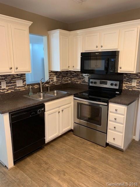 534 Funderburk Road Wingate, NC 28174 - Photo 4 of 11 a kitchen with a sink stove and microwave
