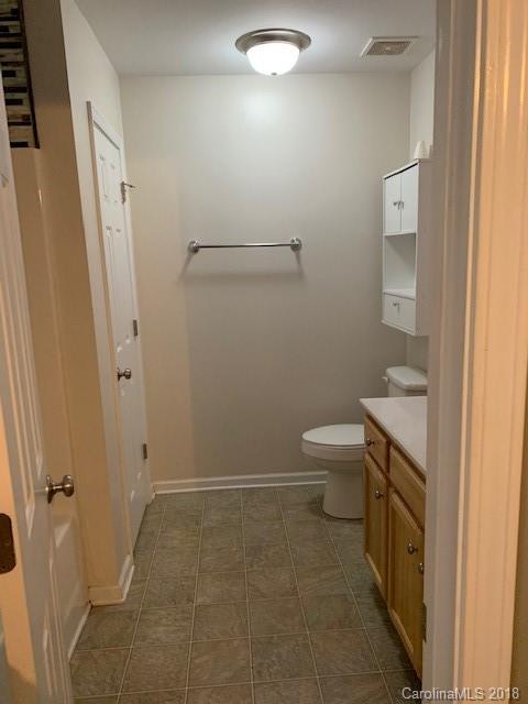 534 Funderburk Road Wingate, NC 28174 - Photo 8 of 11 a bathroom with a granite countertop sink toilet and shower