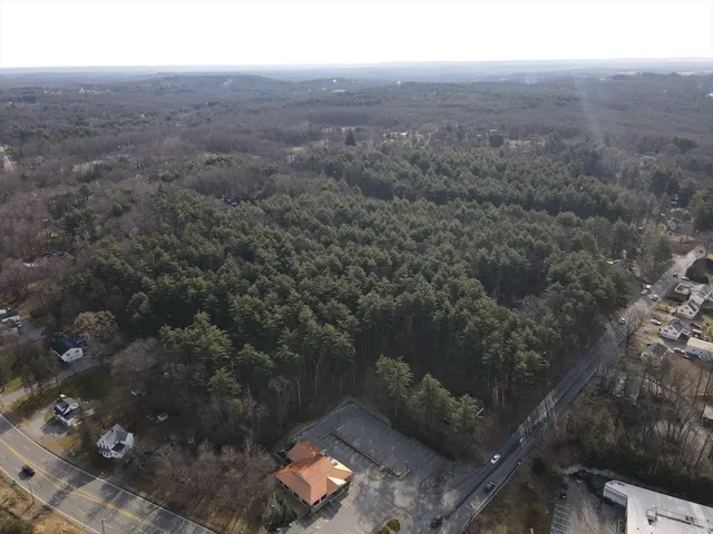 an aerial view of house with yard