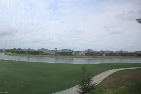 a view of a lake with a city in the background
