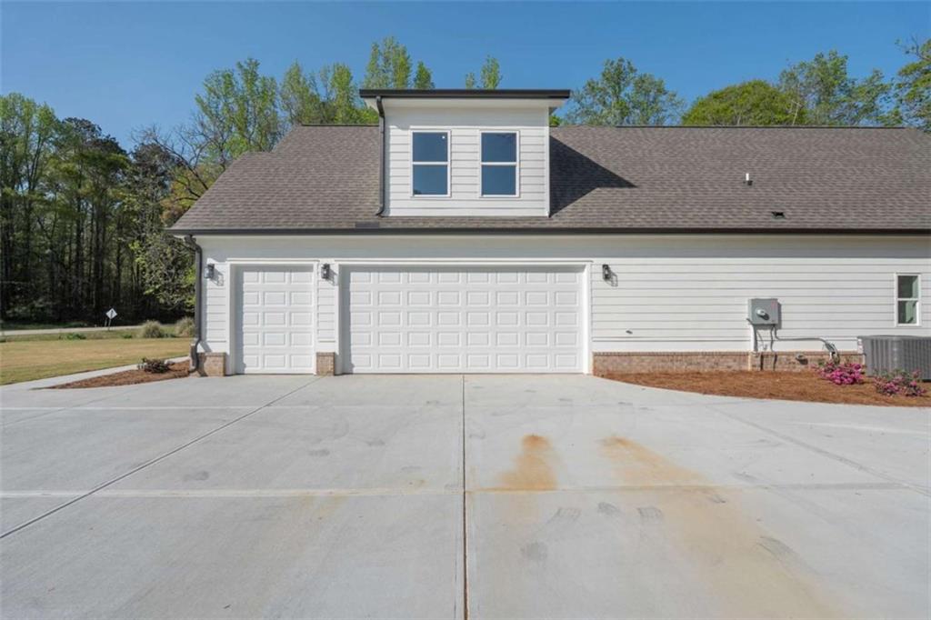 11691 Hazelbrand Road Northeast Covington, GA 30014 - Photo 5 of 53 front view of a house with a road