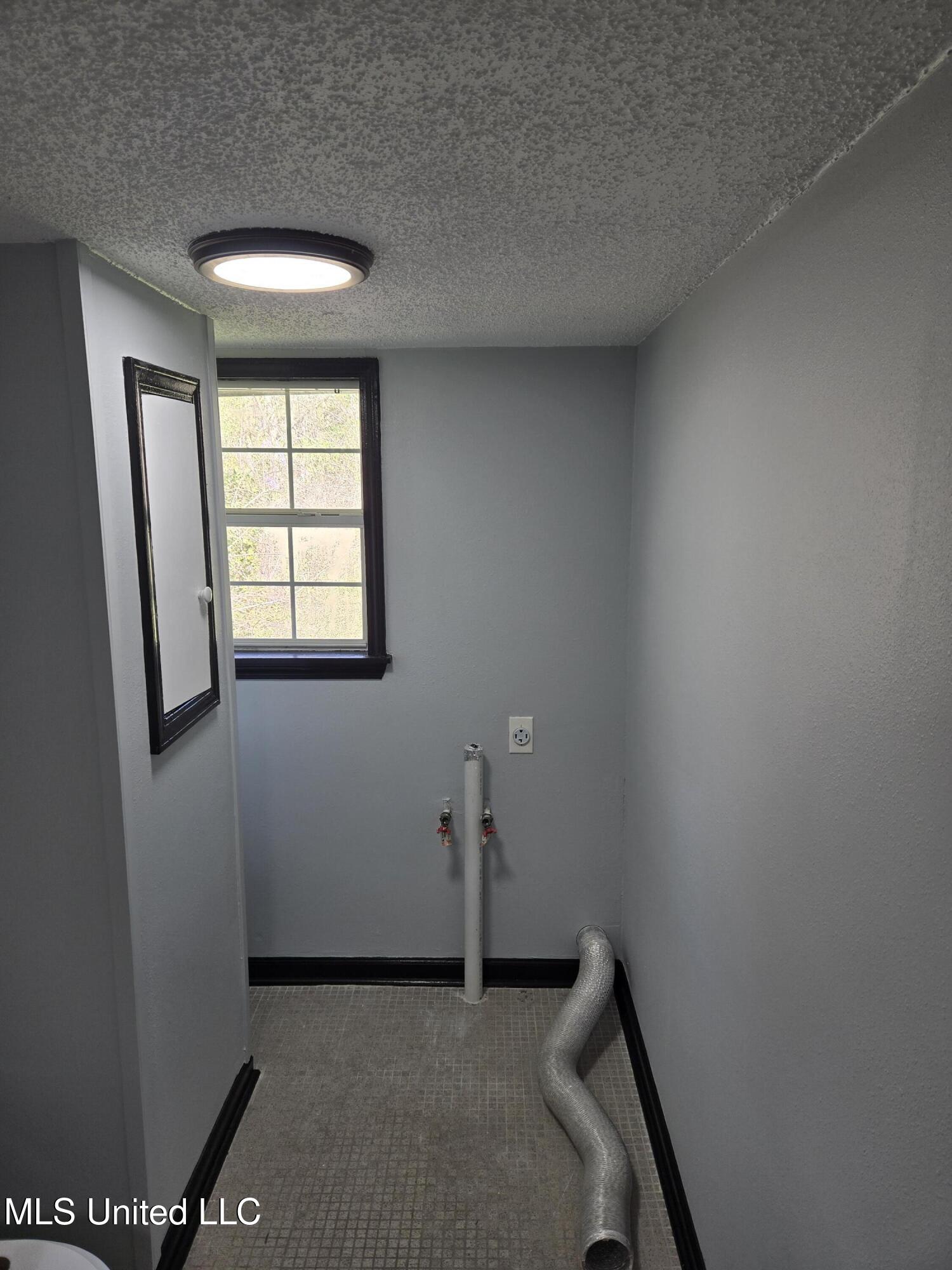 1704 Adcox Road Picayune, MS 39466 - Photo 15 of 19 Upstairs laundry