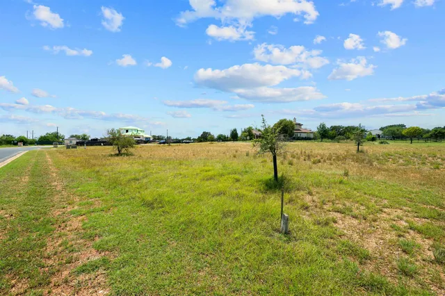 a view of a lake with a big yard