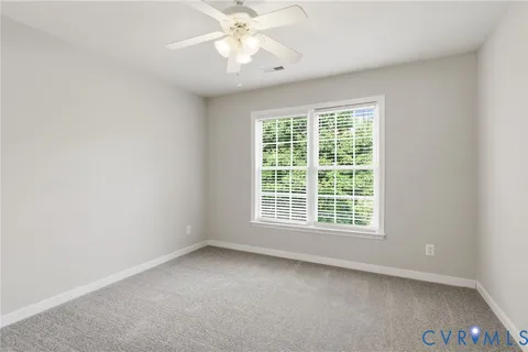 a view of an empty room with stairs