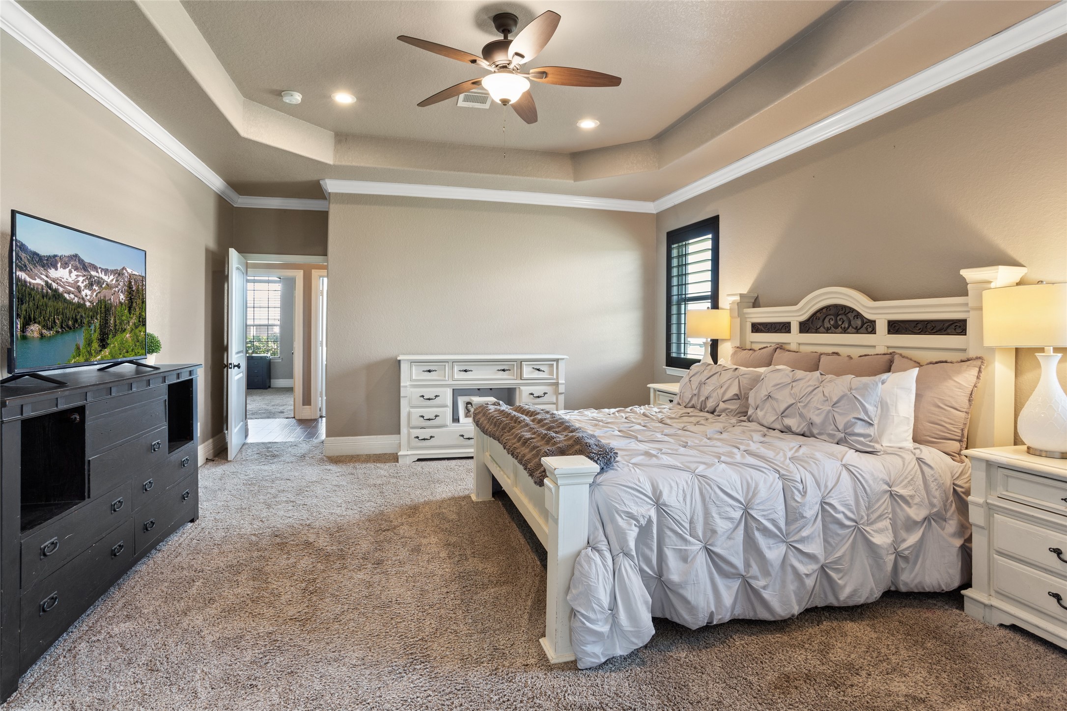7842 Pebble Hill Lane Rosharon, TX 77583 - Photo 16 of 33 a bedroom with a bed and a flat screen tv