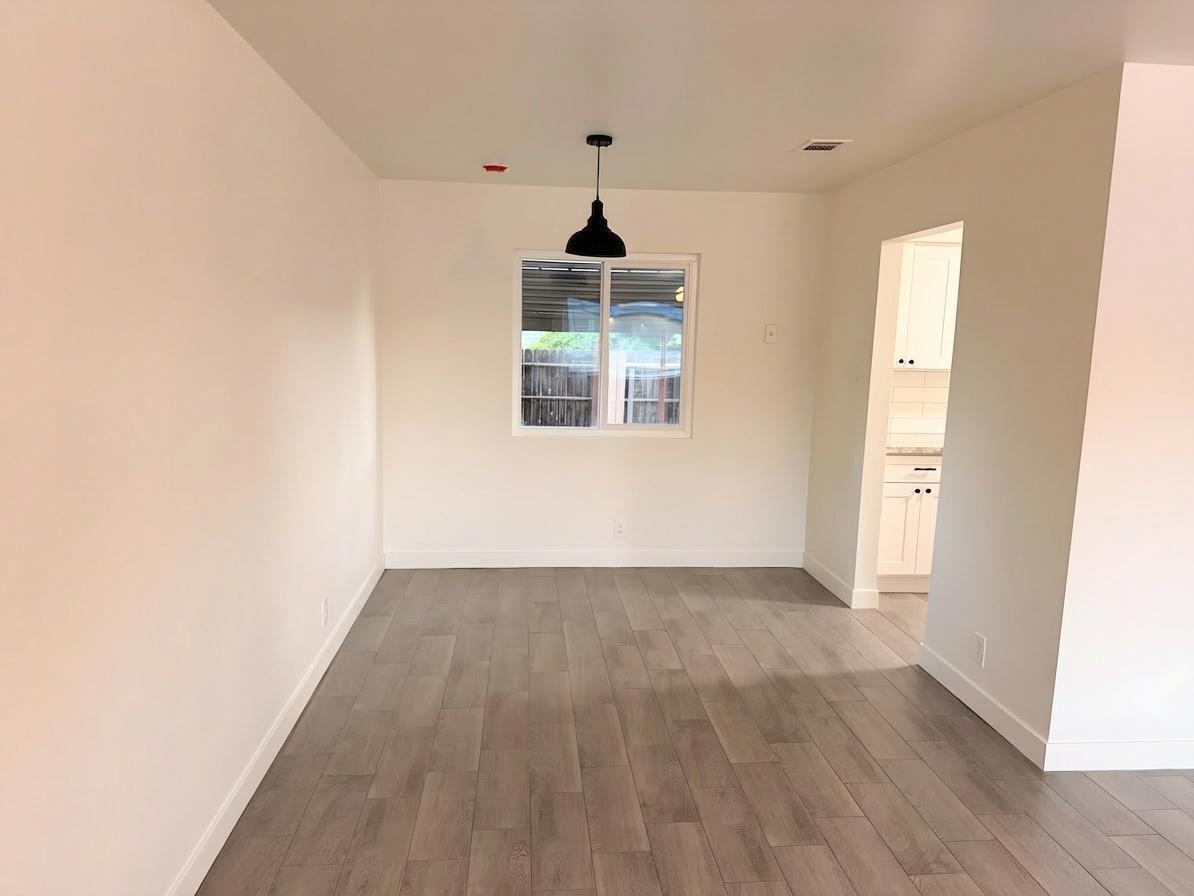 302 Sequoia Drive Exeter, CA 93221 - Photo 6 of 20 a window in an empty room