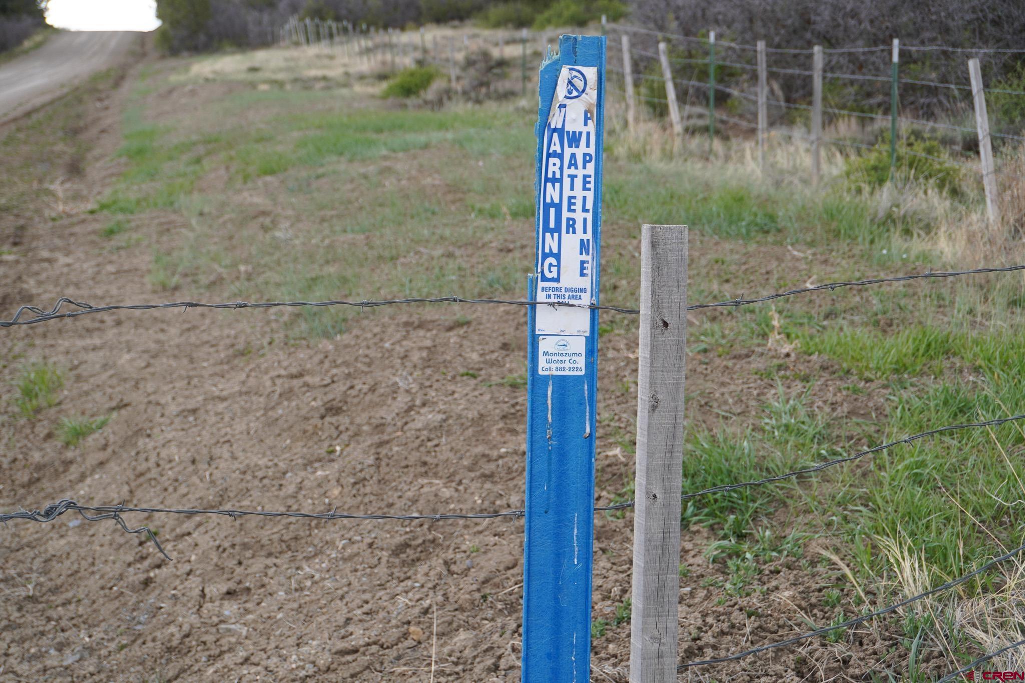 34495 Rd P.2 Mancos, CO 81328 - Photo 25 of 42 a sign that is on the side of a road
