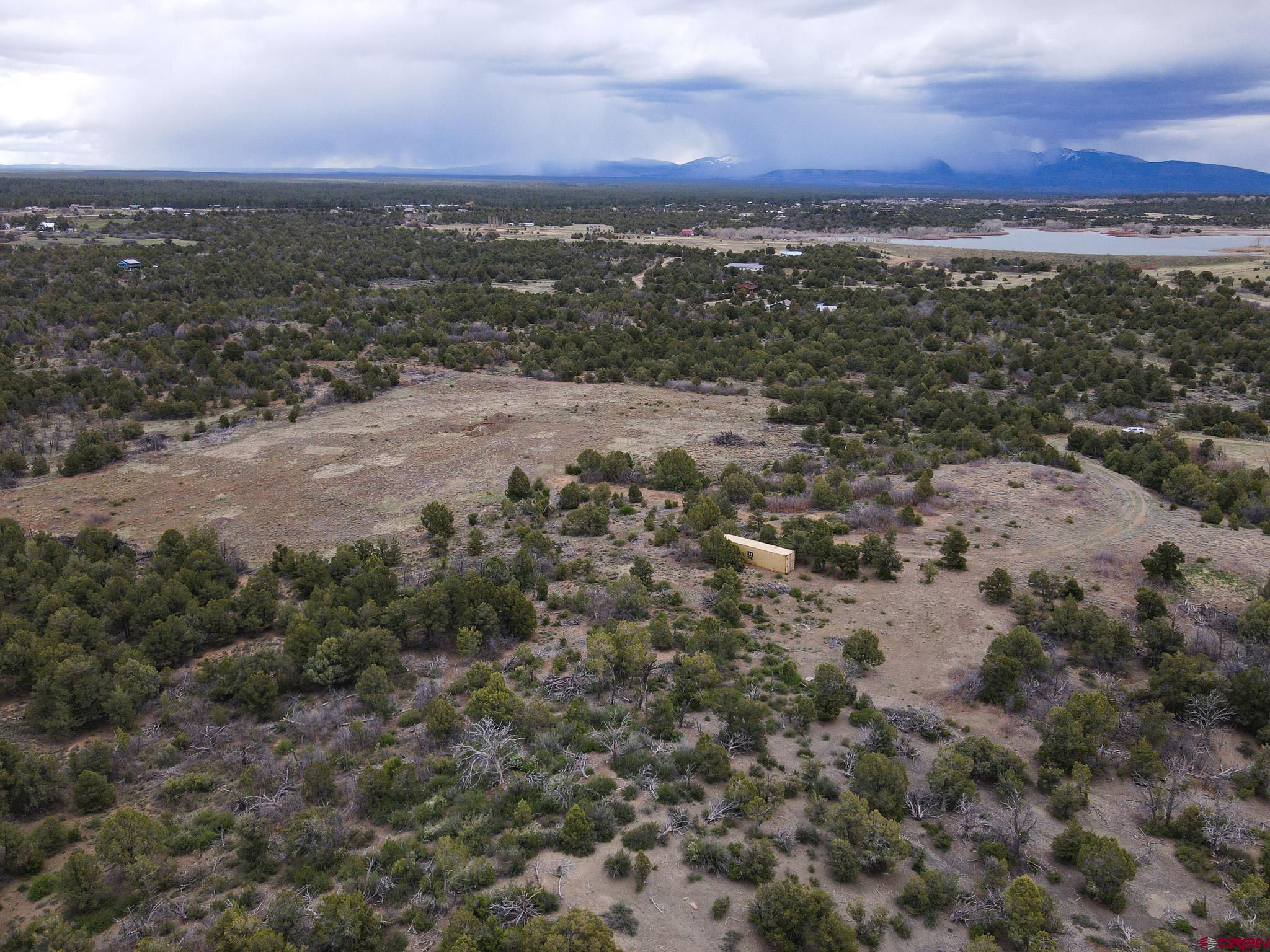34495 Rd P.2 Mancos, CO 81328 - Photo 8 of 42 an aerial view of residential houses with outdoor space