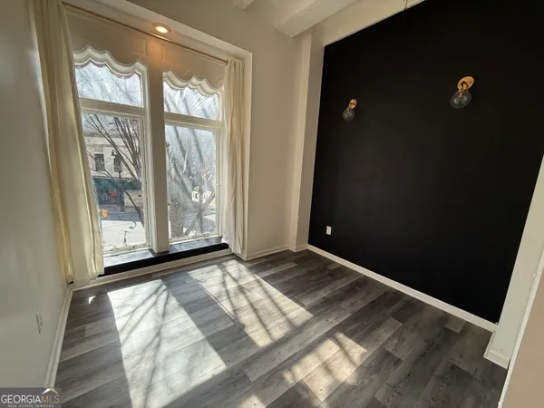 a view of an empty room with a window