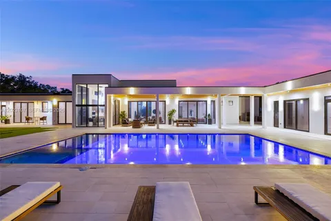 a view of swimming pool with a red chair