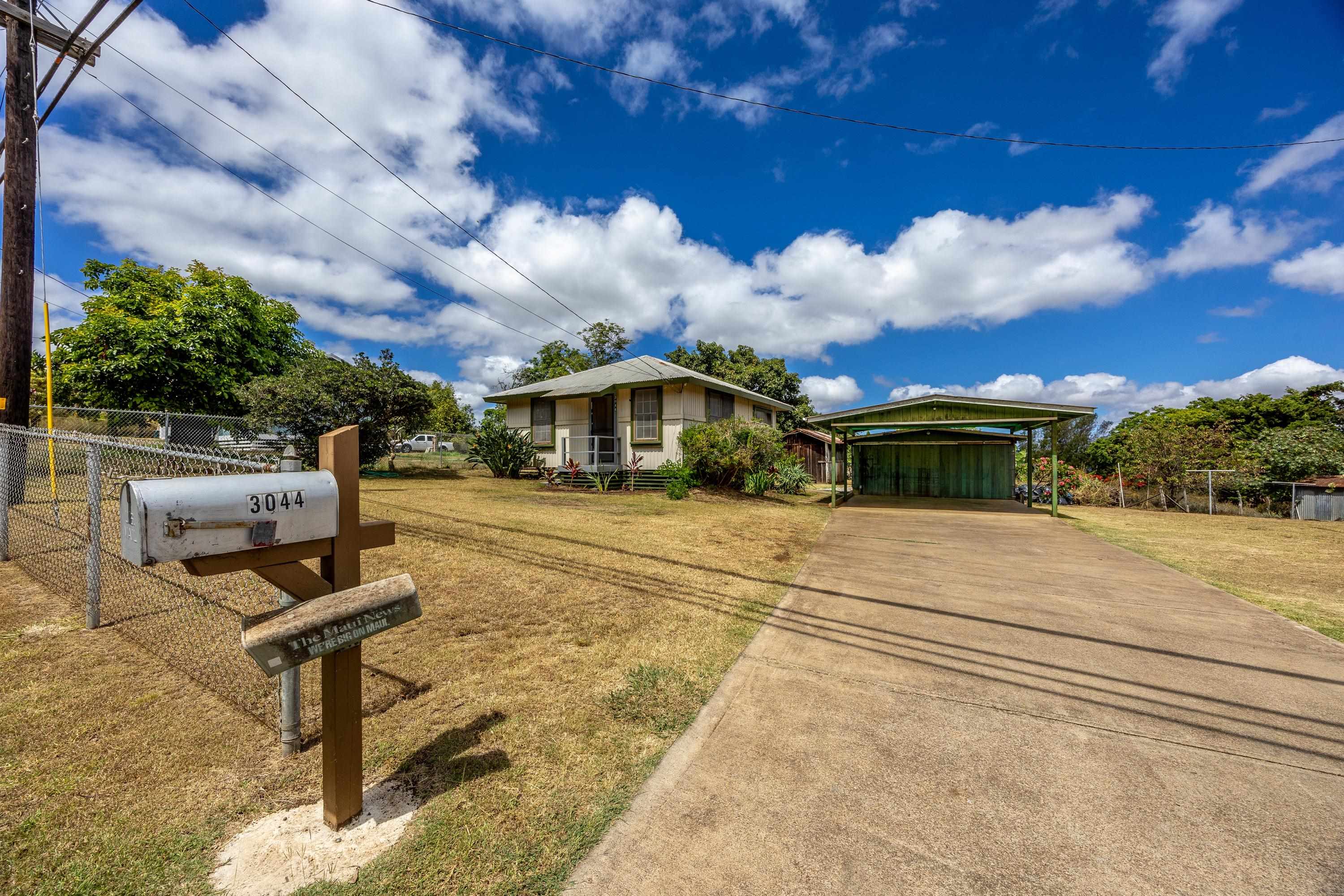 3044 Lower Kula Road Kula, HI 96790 - Photo 11 of 44 a front view of a house with a yard