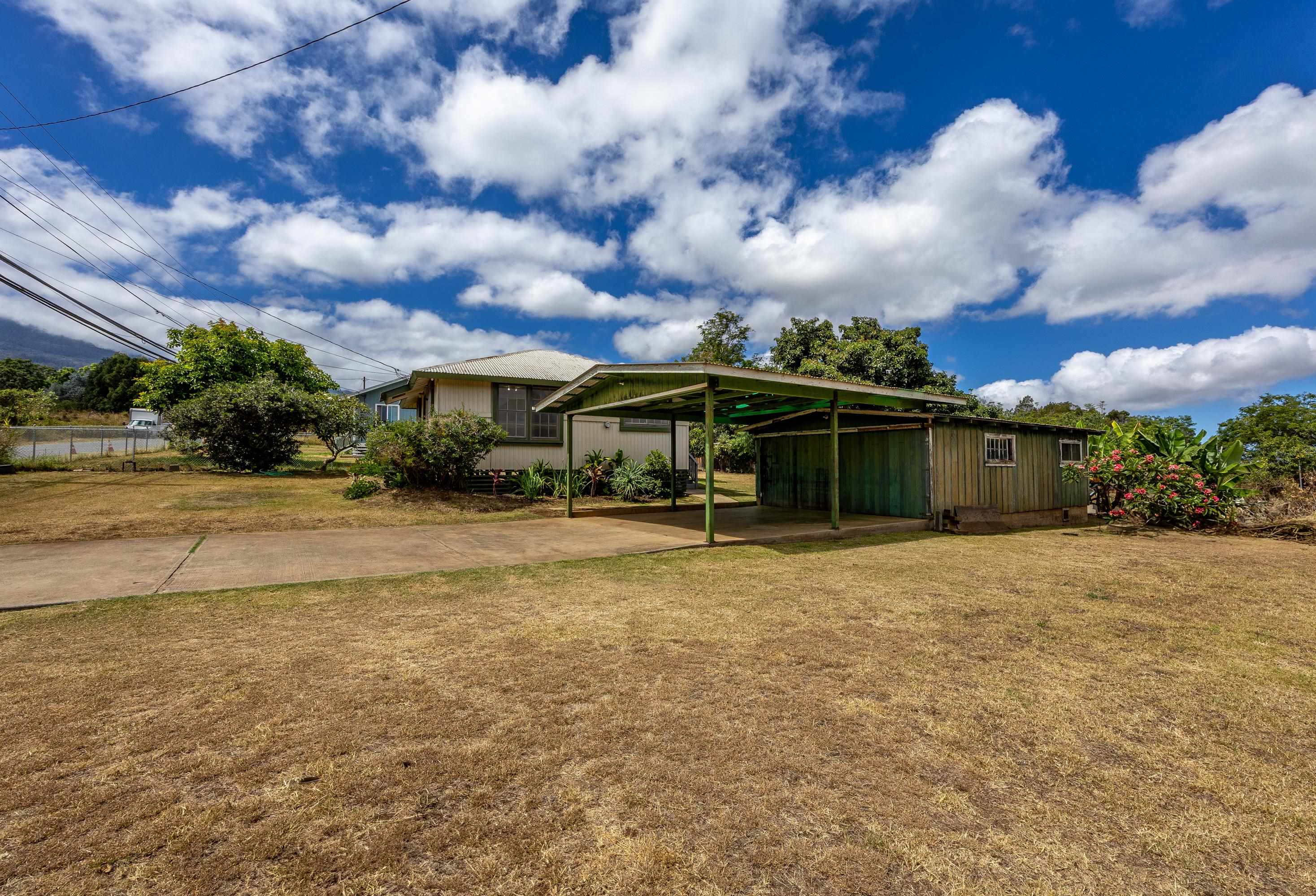 3044 Lower Kula Road Kula, HI 96790 - Photo 12 of 44 a view of an house with backyard space and garden