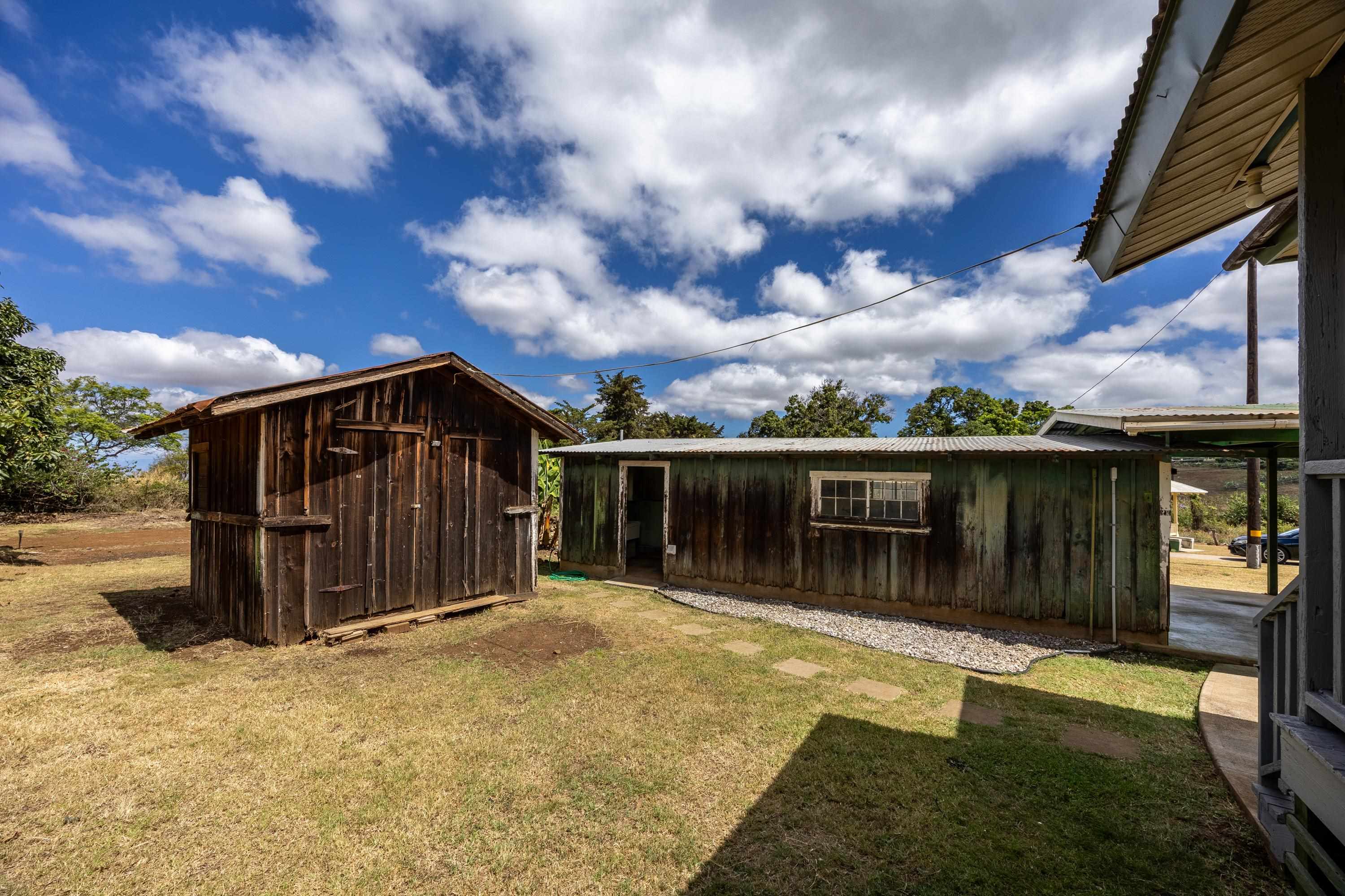 3044 Lower Kula Road Kula, HI 96790 - Photo 16 of 44 a view of house with backyard and seating area