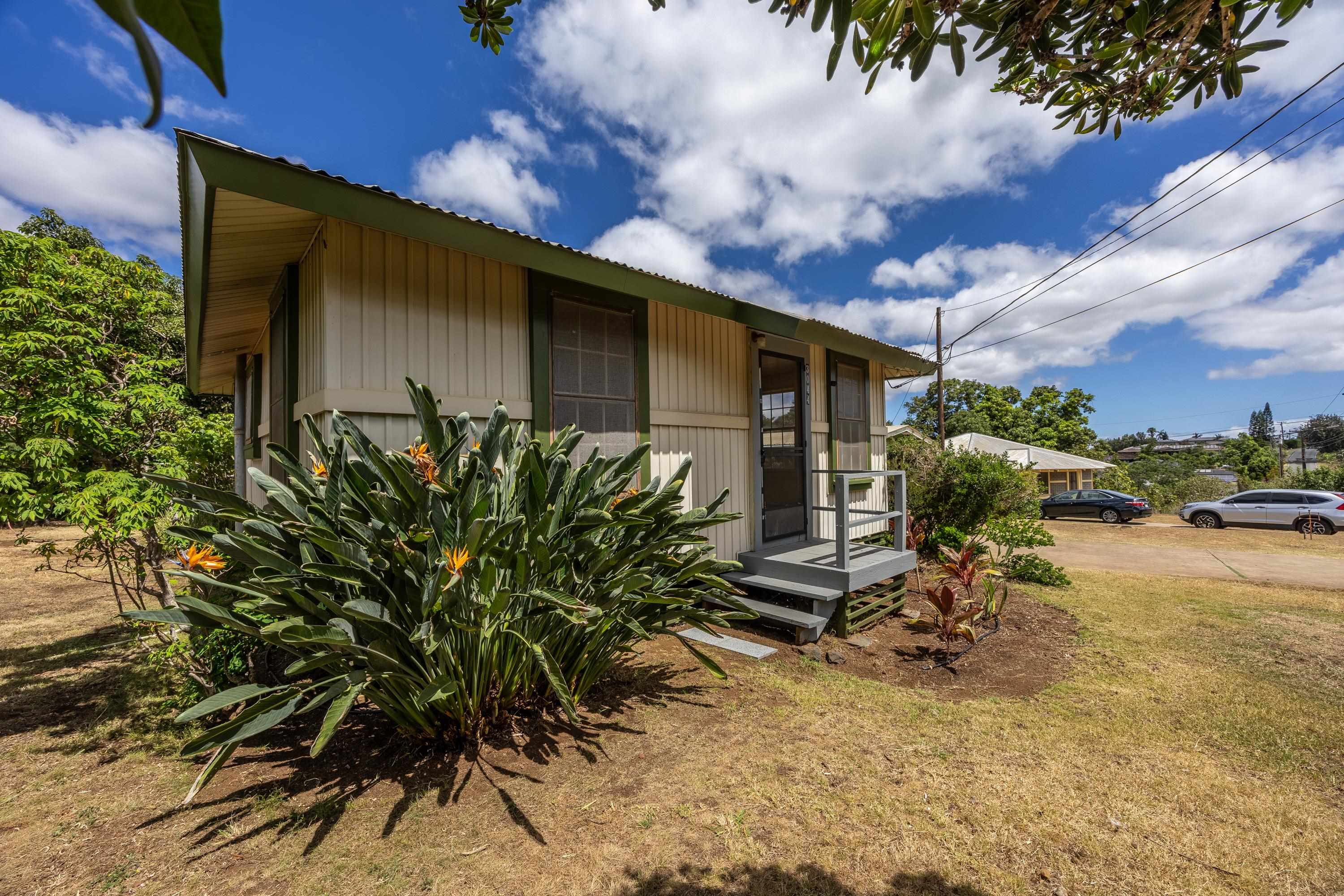 3044 Lower Kula Road Kula, HI 96790 - Photo 17 of 44 a backyard of a house with table and chairs