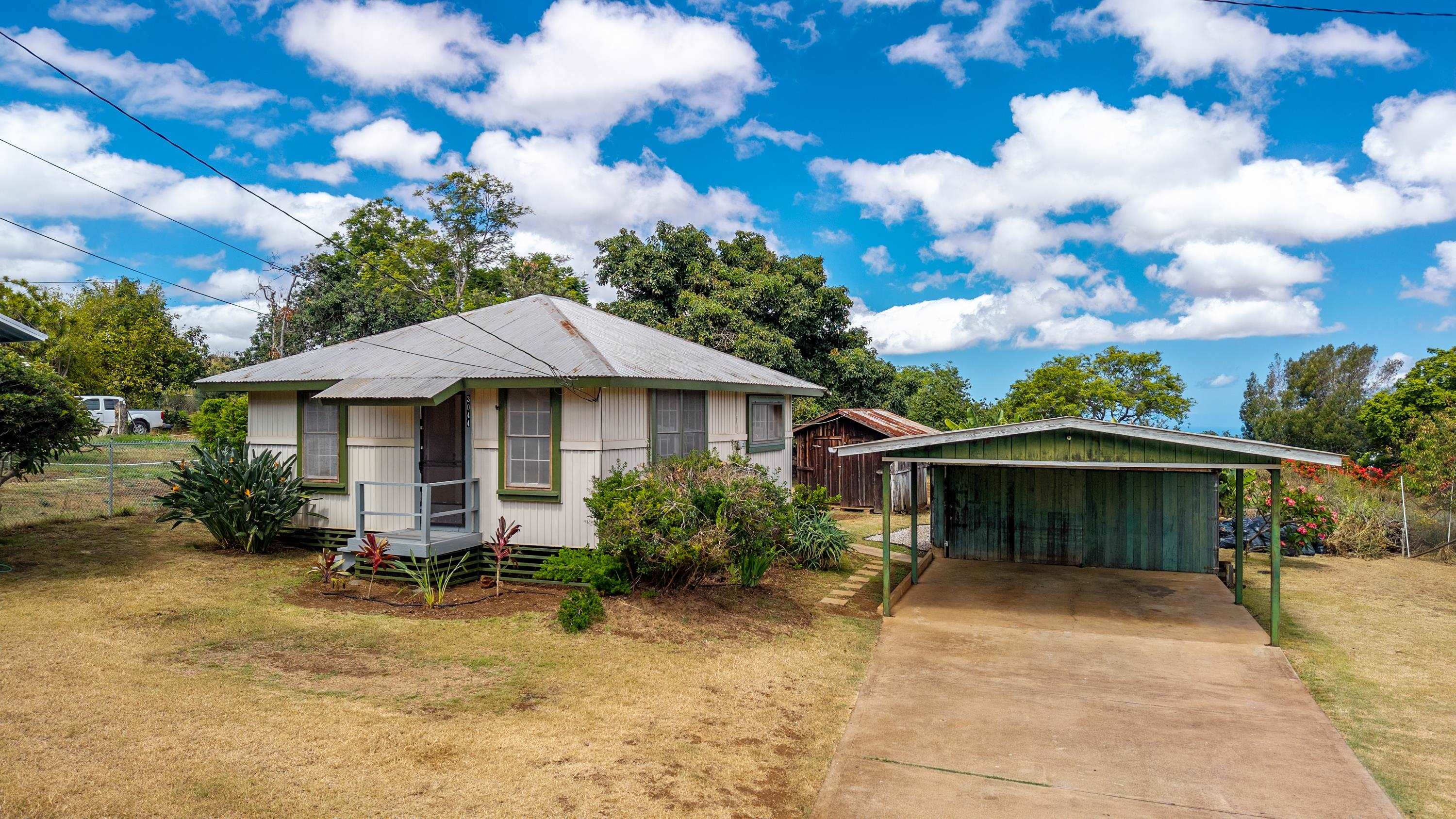 3044 Lower Kula Road Kula, HI 96790 - Photo 40 of 44 a front view of a house with garden