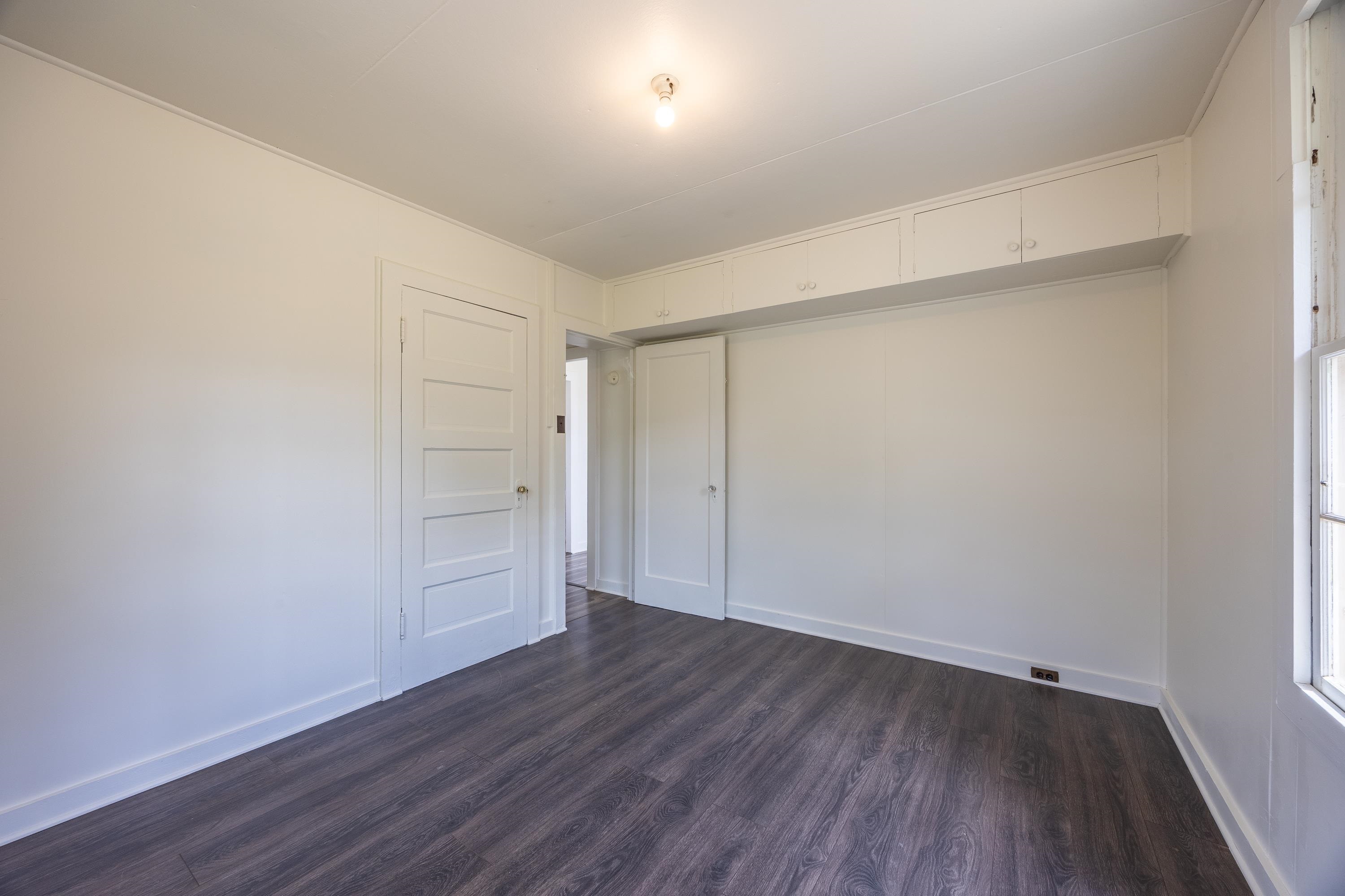 3044 Lower Kula Road Kula, HI 96790 - Photo 10 of 44 a view of an empty room with wooden floor
