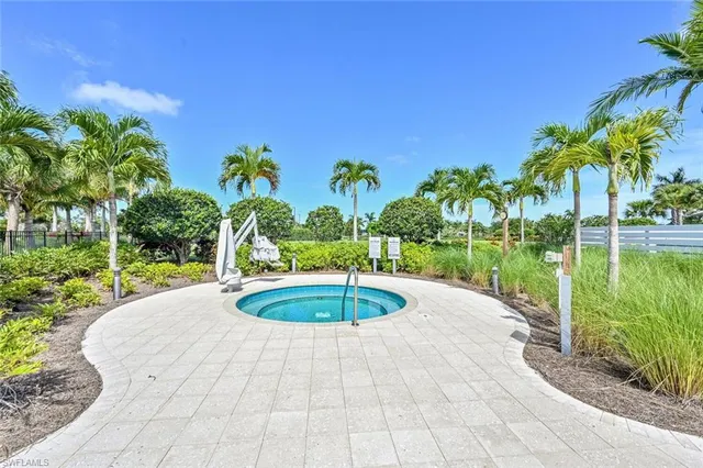 a view of a swimming pool and a yard