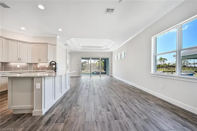 a kitchen with sink and cabinets