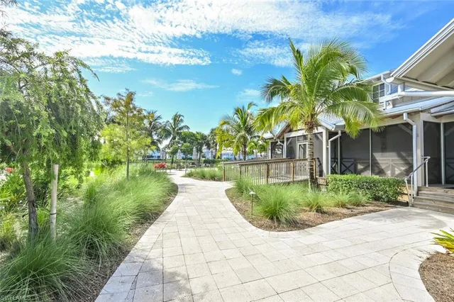 a front view of a house with a yard table and chairs
