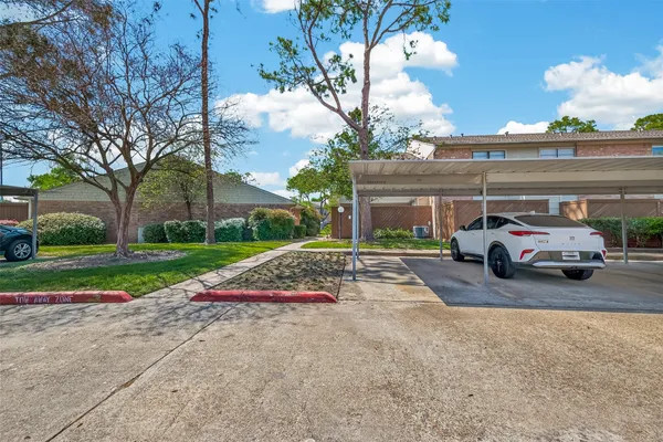 a view of a car parked in front of a house
