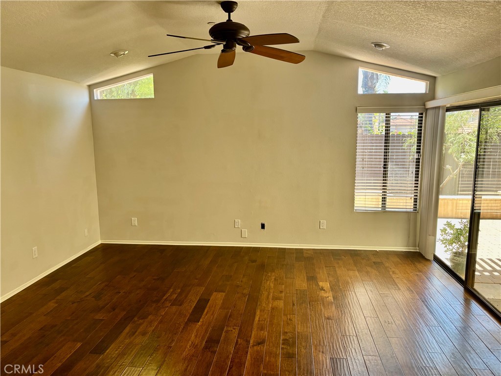 3014 Enrique, Unit 98 San Clemente, CA 92673 - Photo 3 of 14 wooden floor in an empty room with a window