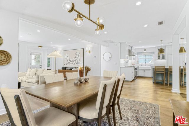 a view of a dining room and livingroom with furniture