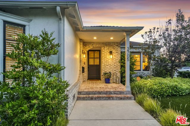 a view of a house with balcony and garden