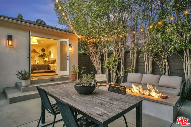 a outdoor space with a table and chairs
