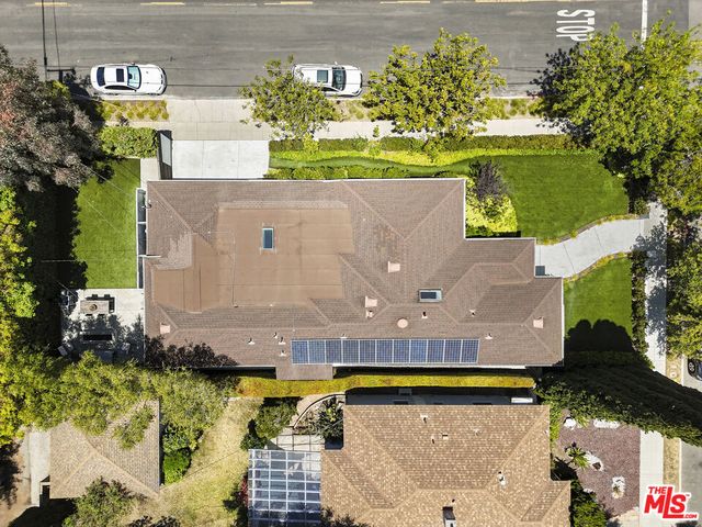 an aerial view of a house with a swimming pool