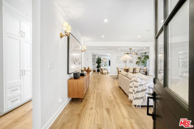 a view of living room with furniture and wooden floor