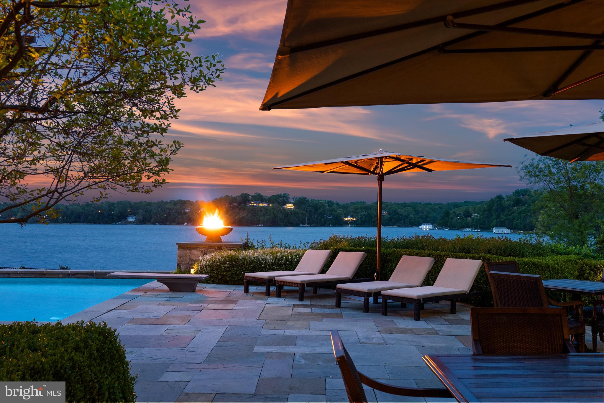 806 Coachway Annapolis, MD 21401 - Photo 2 of 43 a view of a patio with chairs under an umbrella