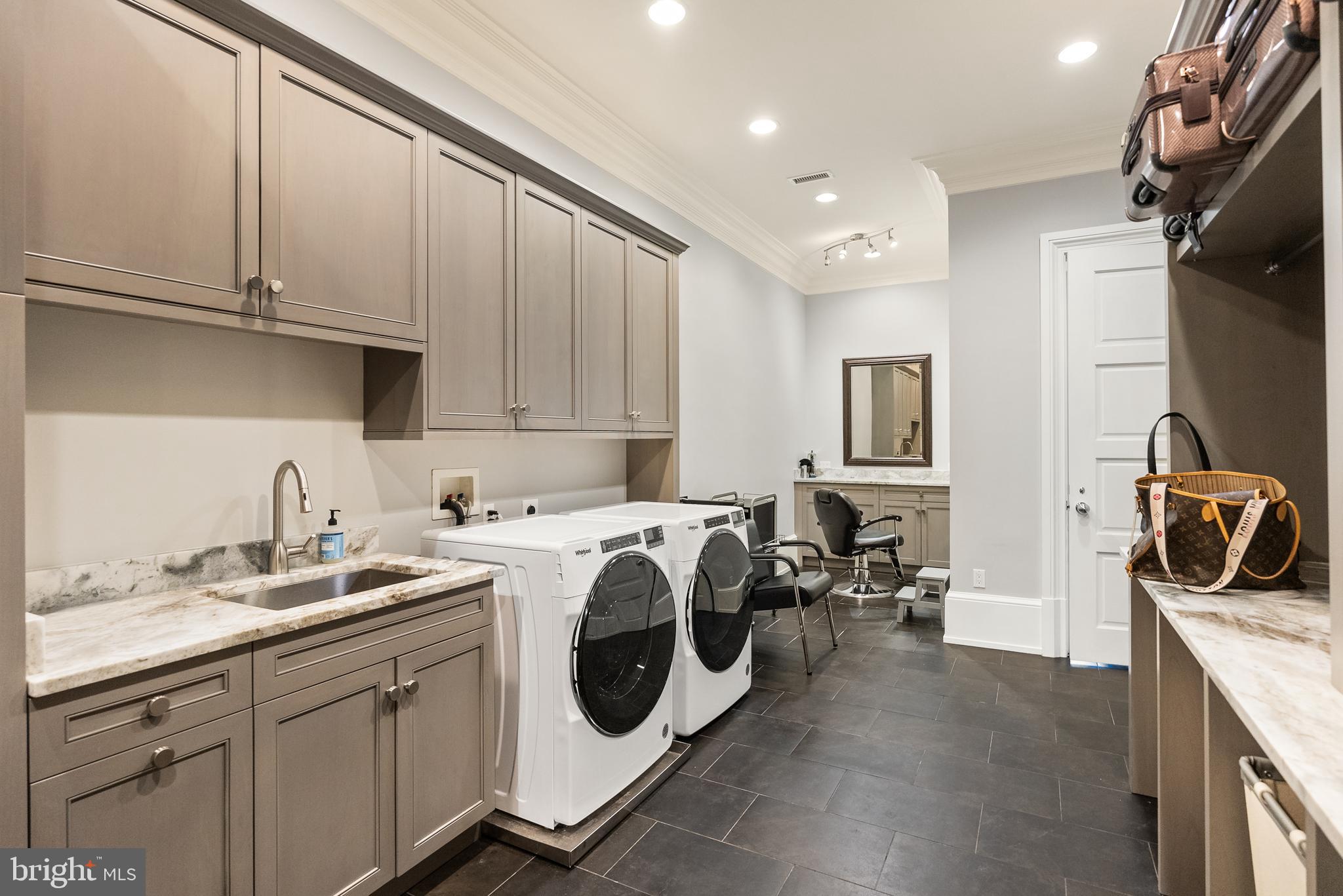 806 Coachway Annapolis, MD 21401 - Photo 28 of 43 a kitchen with a sink a stove and cabinets