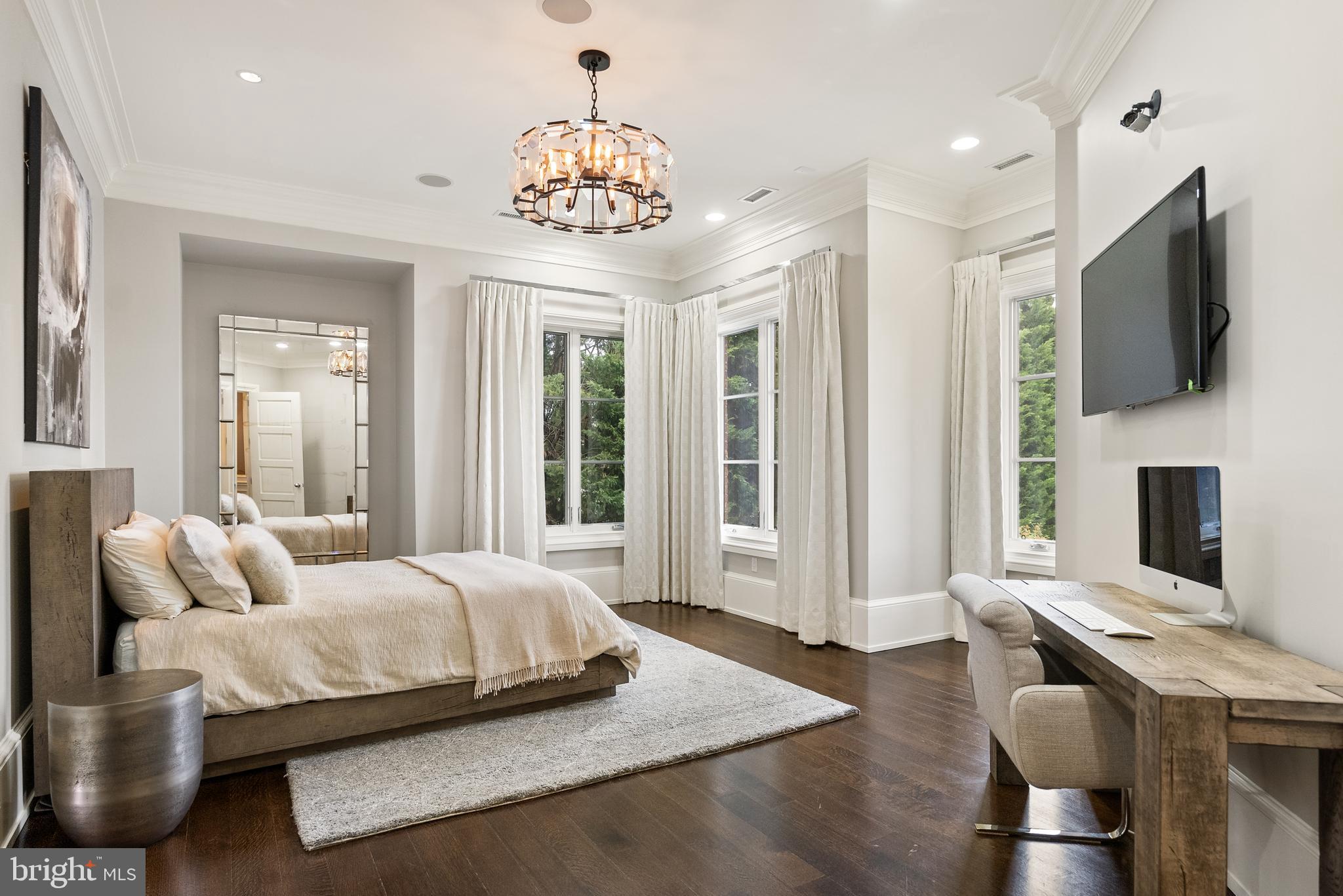 806 Coachway Annapolis, MD 21401 - Photo 29 of 43 a bedroom with a bed and a chandelier