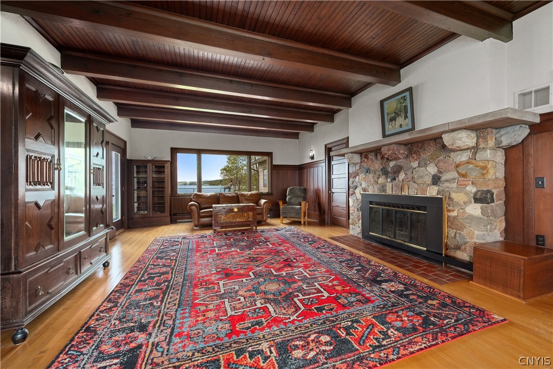 5072 West Lake Road Owasco, NY 13021 - Photo 3 of 50 Spacious living room with exposed wood beam ceilin