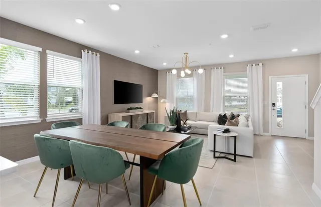 a view of a dining room with furniture window and wooden floor