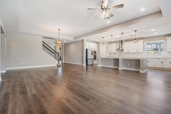 a view of kitchen with cabinets and wooden floor