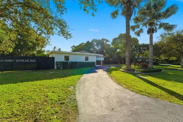 a view of a house with a yard