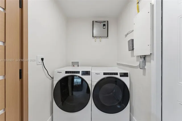 a utility room with dryer and washer