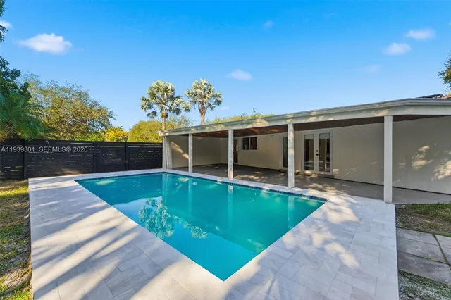 a view of a house with a swimming pool