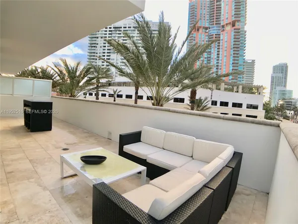 a view of roof deck with furniture
