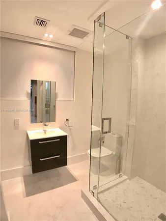 a bathroom with a sink and mirror