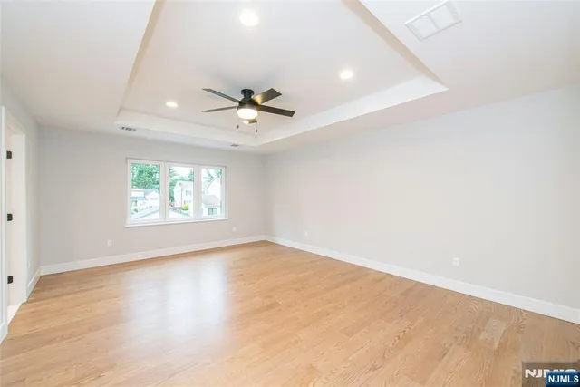 a bathroom with a tub a sink and a window