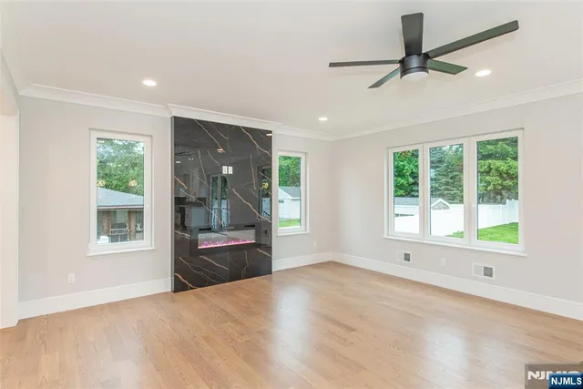 a view of kitchen with a sink a refrigerator and window