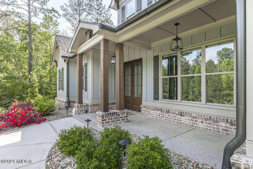 411 Crescent Drive Forsyth, GA 31029 - Photo 11 of 57 a front view of a house with a yard