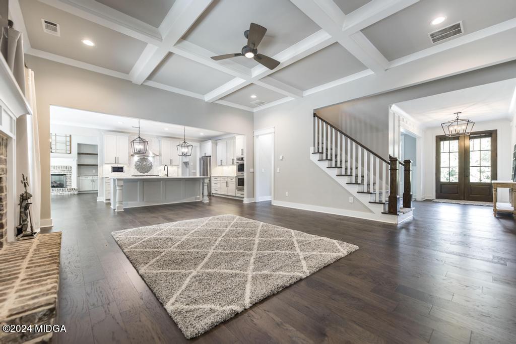 411 Crescent Drive Forsyth, GA 31029 - Photo 15 of 57 an empty room with wooden floor and a ceiling fan