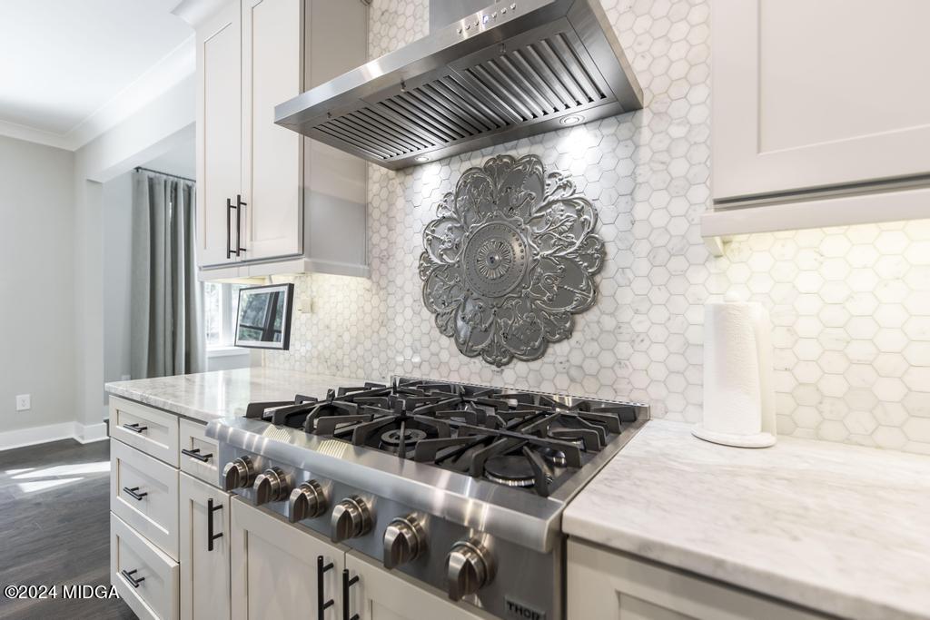 411 Crescent Drive Forsyth, GA 31029 - Photo 21 of 57 a stove top oven sitting inside of a kitchen