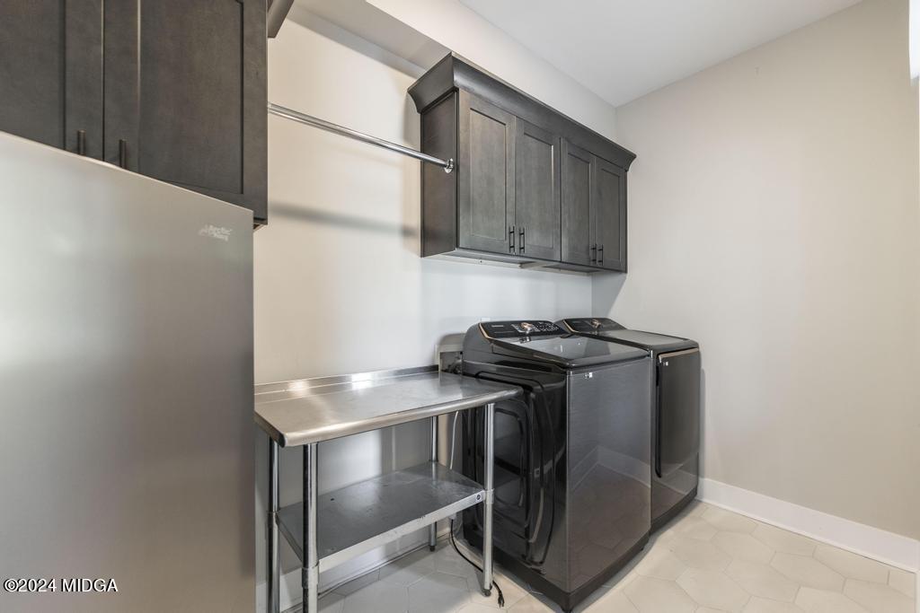 411 Crescent Drive Forsyth, GA 31029 - Photo 24 of 57 a kitchen with stainless steel appliances granite countertop a stove and a refrigerator