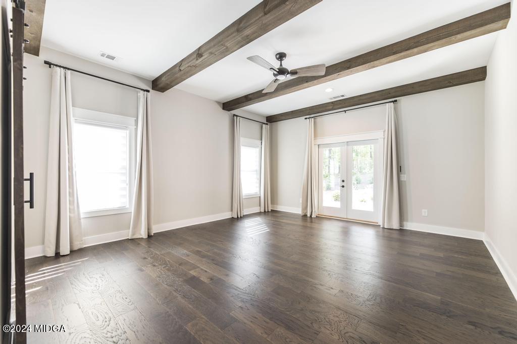 411 Crescent Drive Forsyth, GA 31029 - Photo 27 of 57 a view of an empty room with wooden floor and a window
