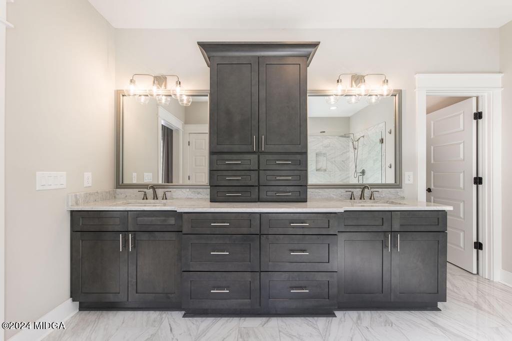 411 Crescent Drive Forsyth, GA 31029 - Photo 30 of 57 a bathroom with a granite countertop double vanity sink and mirror