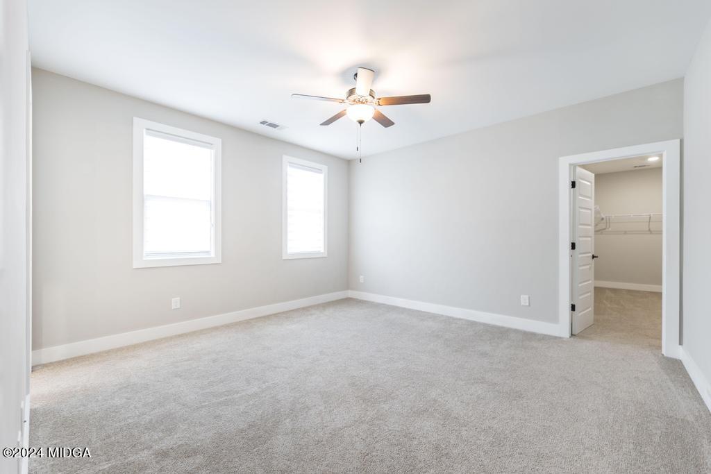 411 Crescent Drive Forsyth, GA 31029 - Photo 35 of 57 a view of an empty room with a window